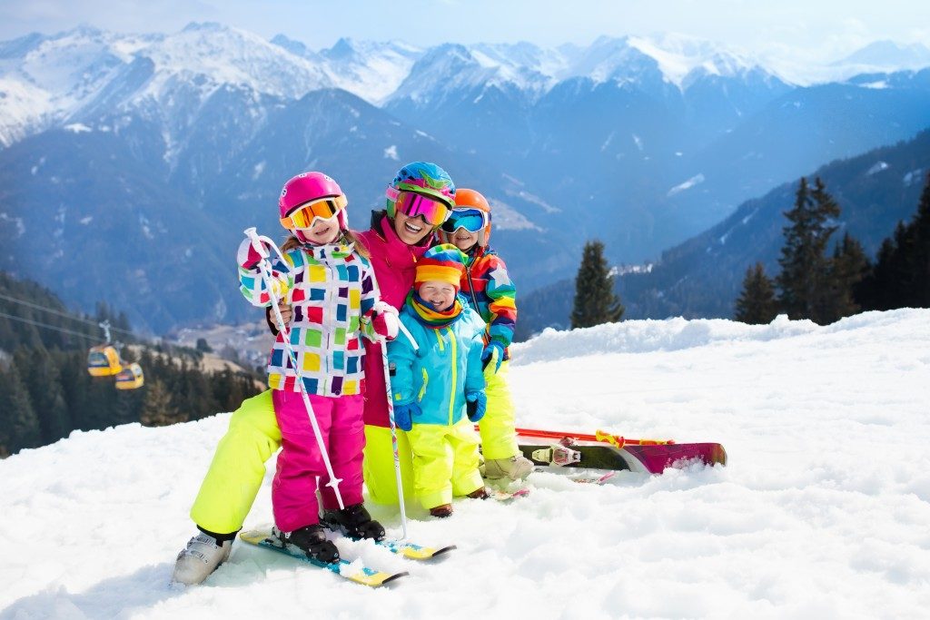 family skiing in the swiss alps