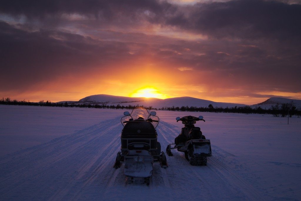 Snowmobile in the sunset