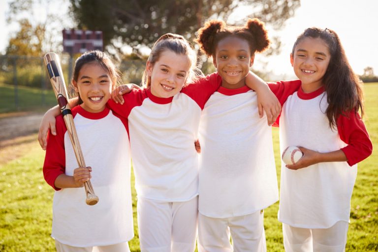 young girls playing baseball